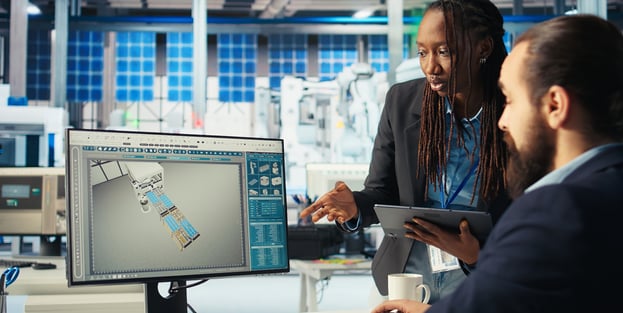Two Ontrac engineers reviewing a system design on screen